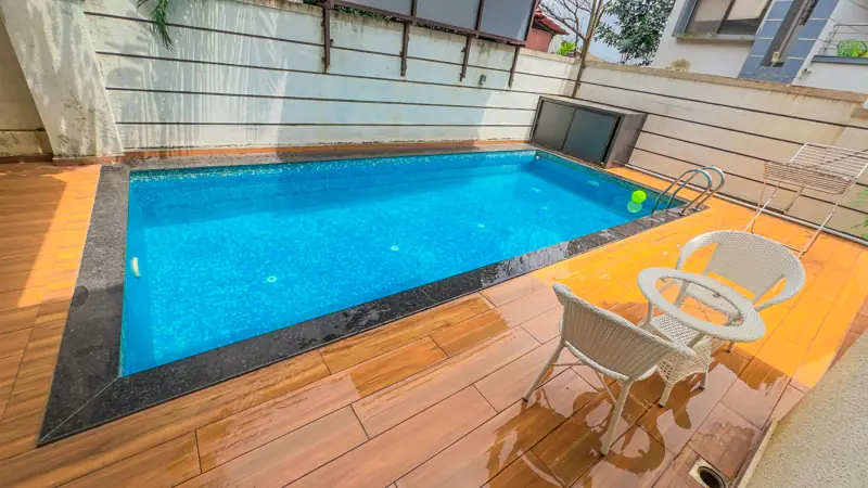Poolside chairs on the wooden deck